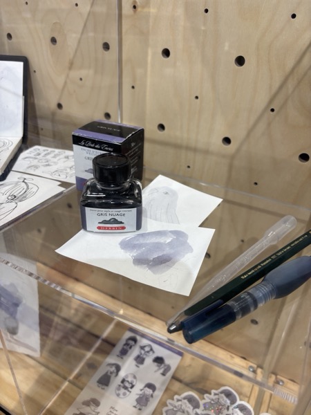 Ink and wash tests, in a display case